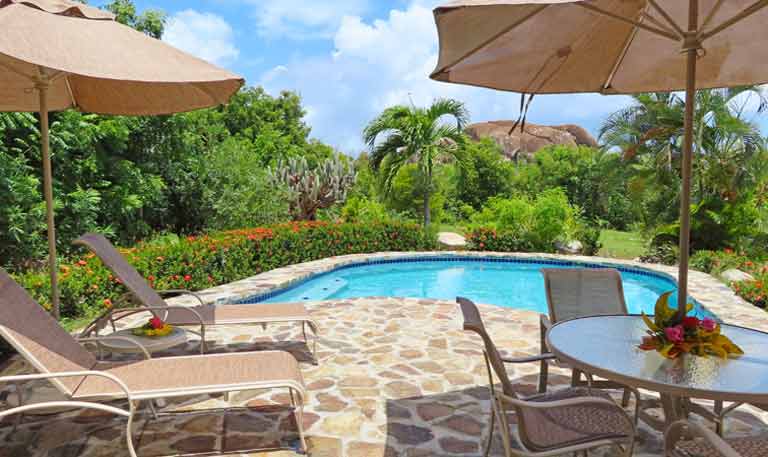 chaise lounges by pool